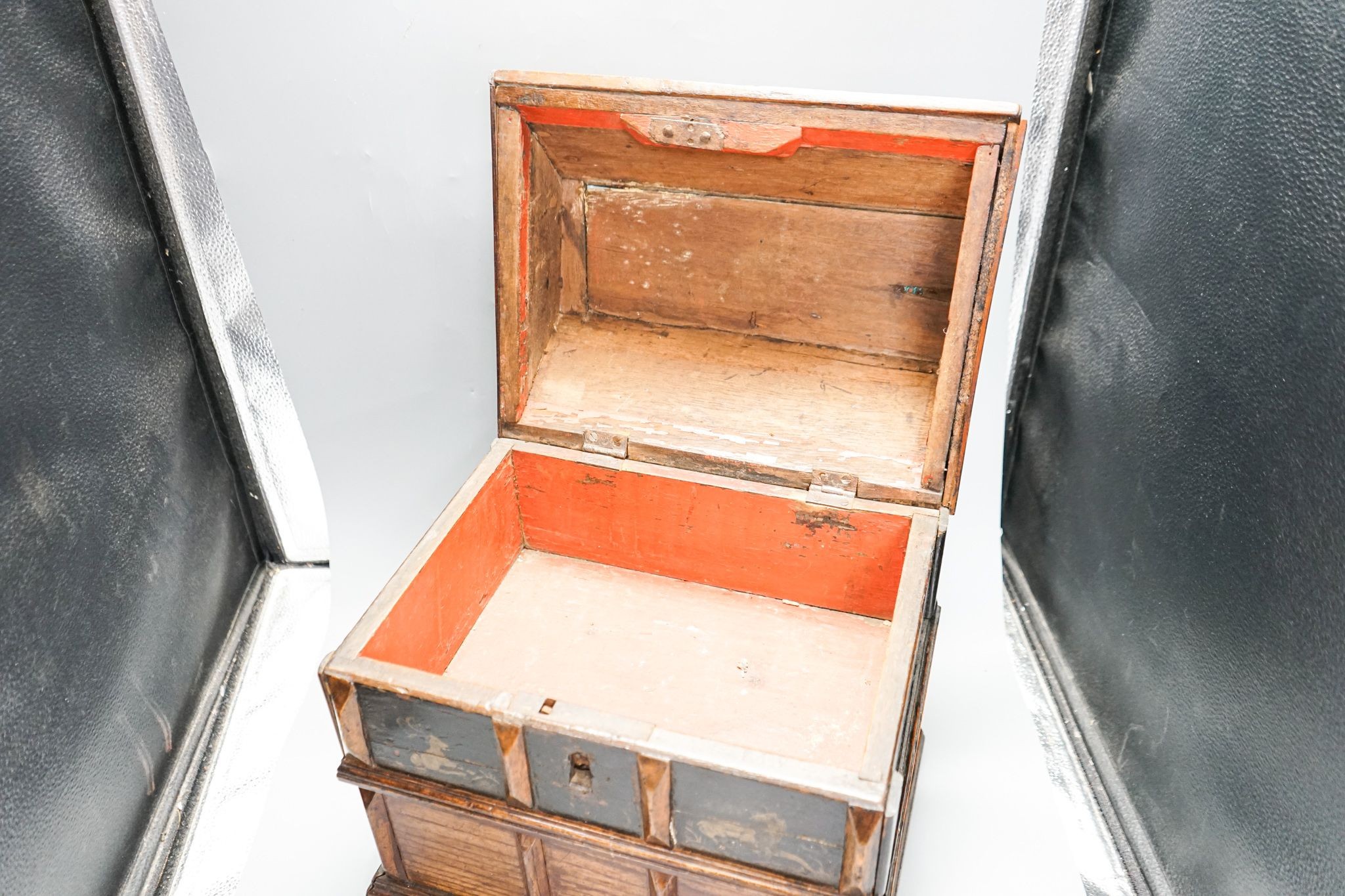 An unusual early 18th century Continental painted chestnut, oak and walnut table-top trunk with concealed drawers 38cm